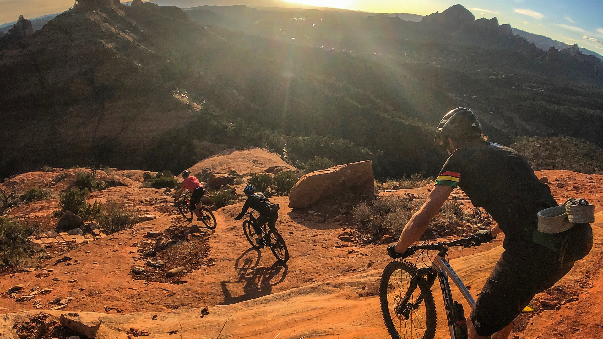 Lars rides in front, followed by another biker and Adam Prosis in back. 
